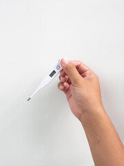 hand holding thermometer white background