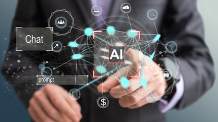 Artificial intelligence concept businessman holding ai on computer screen to using for in document management system and data analysis works