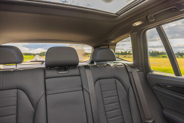 Beautiful view of the interior of the leather rear seats of the car. 