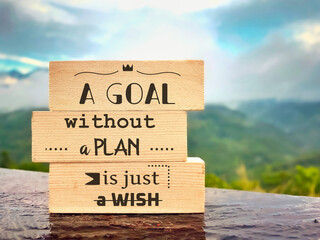 Inspirational motivational quote - A goal without a plan is just a wish on wooden blocks with...