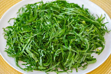 Kale leaves chopped and sliced into thin strips