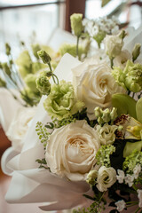 white and green bouquet with eustoms and roses