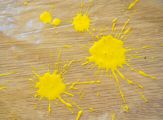 Drops of yellow paint on the floor after renovation