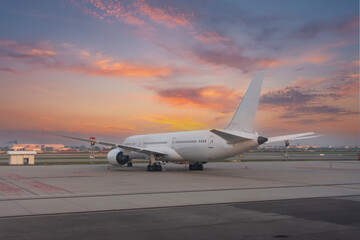 Fototapeta na wymiar Airliners jet plane rear view of the wings and tail during a bright dawn of beautiful sky.