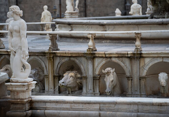 ancient Statues in piazza square in palermo sicily italy animal sculptures looking at female figure...