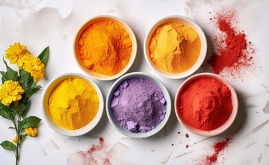 Happy Holi decoration. Top view of colorful holi powder on white background. Hindu spring festival of colours. Top view of traditional holi paint in bowls isolated on white