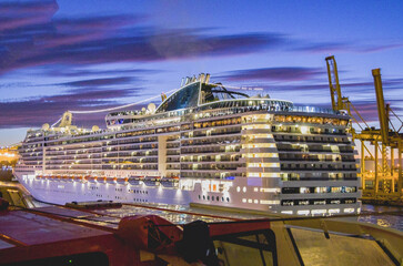 Mega modern cruise ship cruiseship liner Preziosa in port of Barcelona, Spain sail away for...