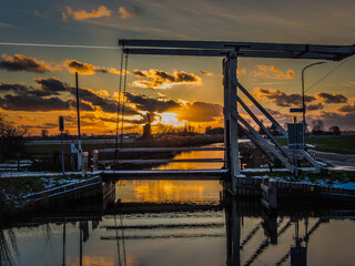 sunset through bridge