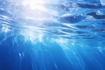 Fototapeta na wymiar Serene Underwater Sunlight Rays Penetrating Clear Blue Ocean