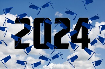 Airborne blue graduation caps for 2024 in sky with white clouds 
