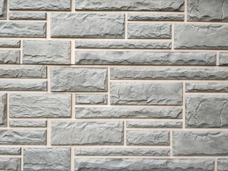 Grey stone tiles on the wall. Background. Texture.