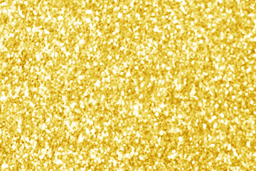 Golden yellow glitter bokeh background. Photo can be used for New Year, Christmas and all celebration concepts.