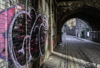 View of tunnel under South Bridge on Cowgate street in Edinburgh, The capital of Scotland. Space...
