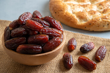 Date fruits and traditional Ramadan pita,closeup