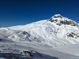 Obraz premium Ski touring in Glarnerland and Schwyz. Ski mountaineering on the Pfannenstock. Skitour above Braunwald Glarus. Skimo in winter country. High quality photo.