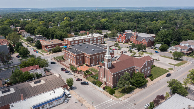 Independence, Missouri, USA - June 16, 2023: Afternoon sunlight shines on the historic core of downtown Independence.