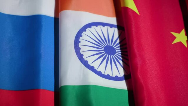 Panning shot of BRICS Nations Brazil Russia India China South Africa on dark background