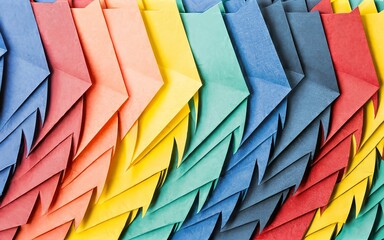 Fototapeta premium abstract background of colored pieces of paper in the form of arrows