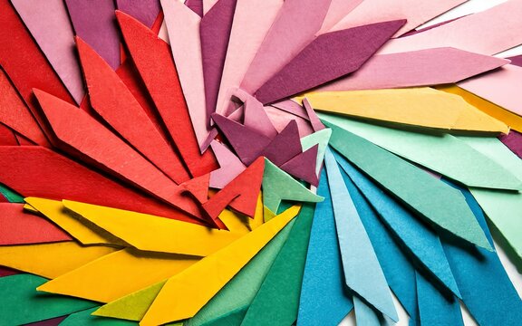 abstract background of colored pieces of paper in the form of arrows
