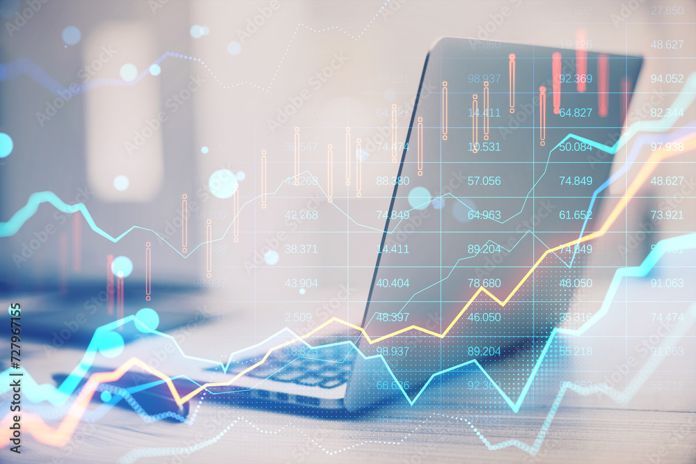 Poster close up of laptop computer and supplies on desk with glowing forex chart on blurry bokeh background