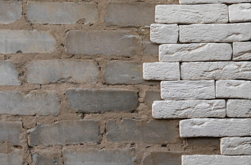 textured old brick wall made of two different materials
