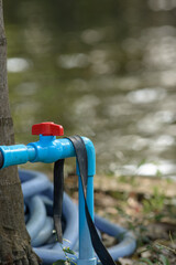 PVC ball valve mount to water pipe line on natural light background.