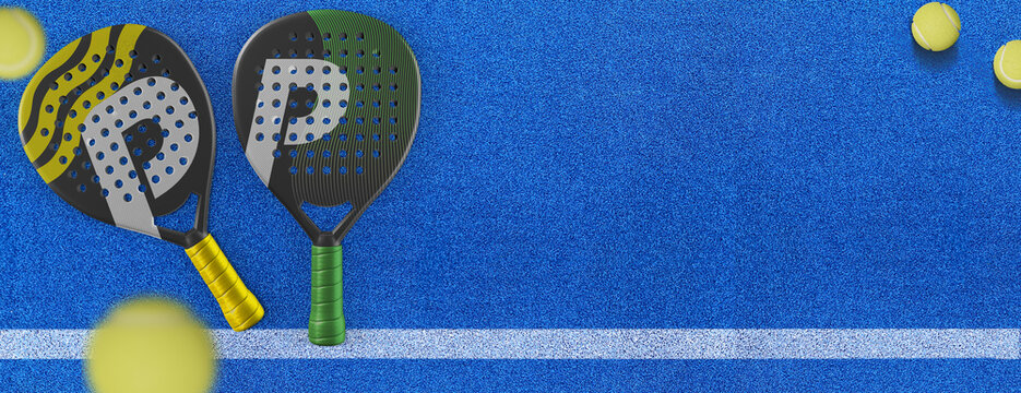 Close up of a padel ball and rackets on a blue syntehtic playground	