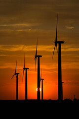 wind turbines at sunset