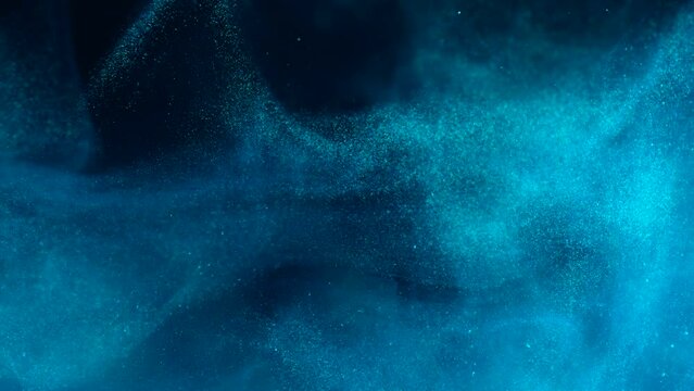 White luminous particles shimmer in blue liquid. Abstract digital particle wave and light abstract background. Floating particals in ocean. 