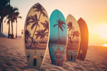 Schilderijen op glas Surfboards palm patterns on the beach with palm trees and sunset sky background. Surfboards on the beach. Vacation Concept with Copy Space. © John Martin