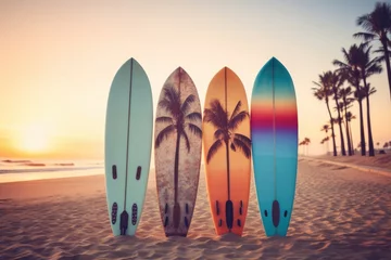 Foto op Plexiglas Surfboards palm patterns on the beach with palm trees and sunset sky background. Surfboards on the beach. Vacation Concept with Copy Space. © John Martin
