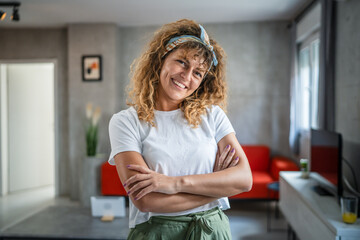 Close up portrait of one adult woman with curly hair happy smile