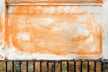 Grunge texture painted in peach fuzz, old wall surface as background