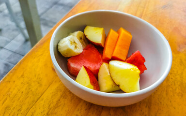 Fruit in bowl for breakfast watermelon apple strawberry mango banana.