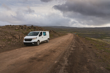 Camper van parked at the side of the road at Dynjandisheiði Heath in summer in the Westfjords, Iceland - obrazy, fototapety, plakaty