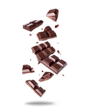 Broken bar of dark chocolate in the air isolated on a white background