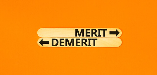 Demerit or merit symbol. Concept word Demerit or Merit on beautiful wooden stick. Beautiful orange...