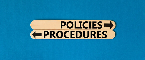 Procedures and policies symbol. Concept word Procedures Policies on beautiful wooden stick. Beautiful blue table blue background. Business procedures and policies concept. Copy space - obrazy, fototapety, plakaty