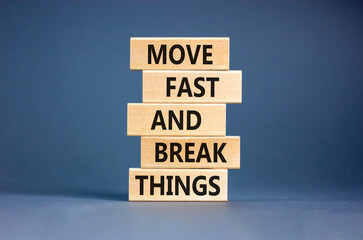 Move fast and break things symbol. Concept words Move fast and break things on wooden blocks. Beautiful grey table grey background. Business, move fast and break things concept. Copy space.