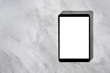 Tablet computer empty white screen mockup on gray marble desk background, blank touchpad template, flatlay, copy space