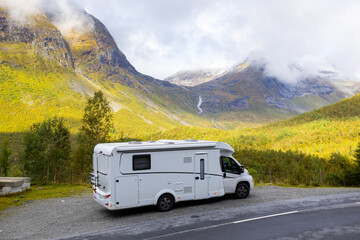 Fototapeta premium Motorhome camper in autumn in Trollstigen road in Norway, Europe