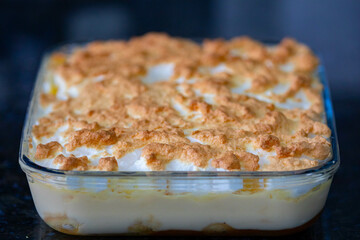 Traditional dessert from southern Brazil known as chico-balanceado, made with 3 layers: caramelized banana, creme anglaise and burnt meringues