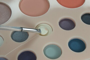 White makeup sponge and eyeshadow palette. High quality photo