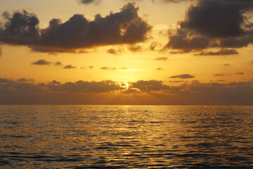 natural background of cloudy sky and sunset over the sea