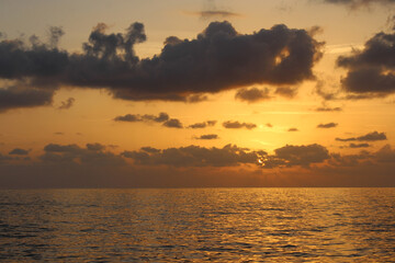 natural background of cloudy sky and sunset over the sea