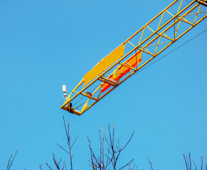 Construction crane at the construction site of an apartment building.