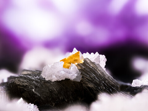 orange Scheelite with white dolomite, black muscovite and purple fluorite.  From Yaogangxian mine, Chenzhou, Hunan, China