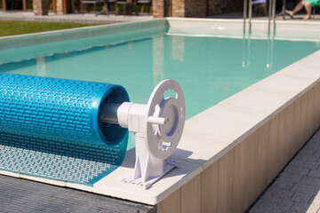 Swimming pool cover for protection against dirt, leaves, heating and cooling water, copy space....