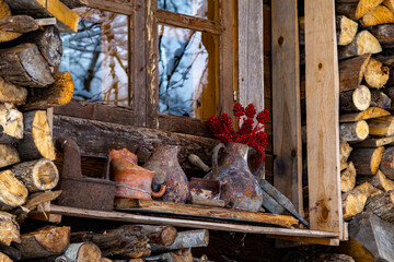 Firewood Storage. Outdoor Firewood Storage Under the Roof Slope. Forest Sauna House. 
