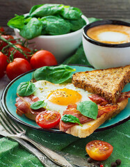 Fototapeta na wymiar Delicious and colorful egg breakfast with coffee tomatoes